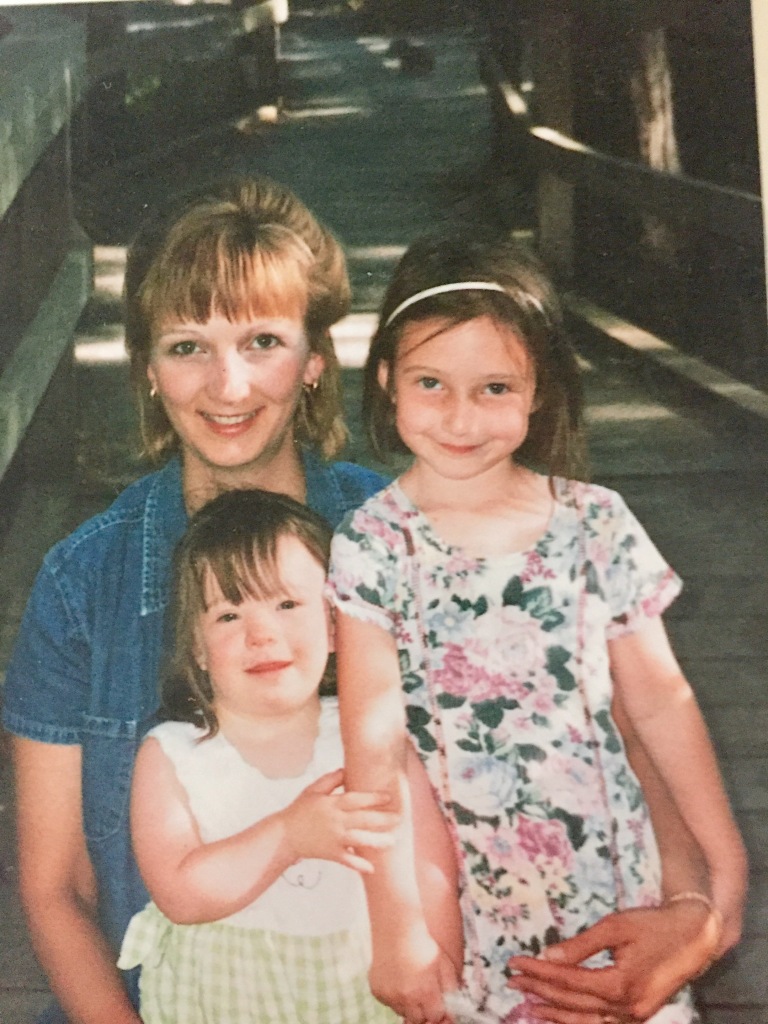 image description: my mom, sister, and I on my 3rd birthday.